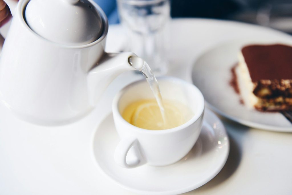 white ceramic teapot and teacup