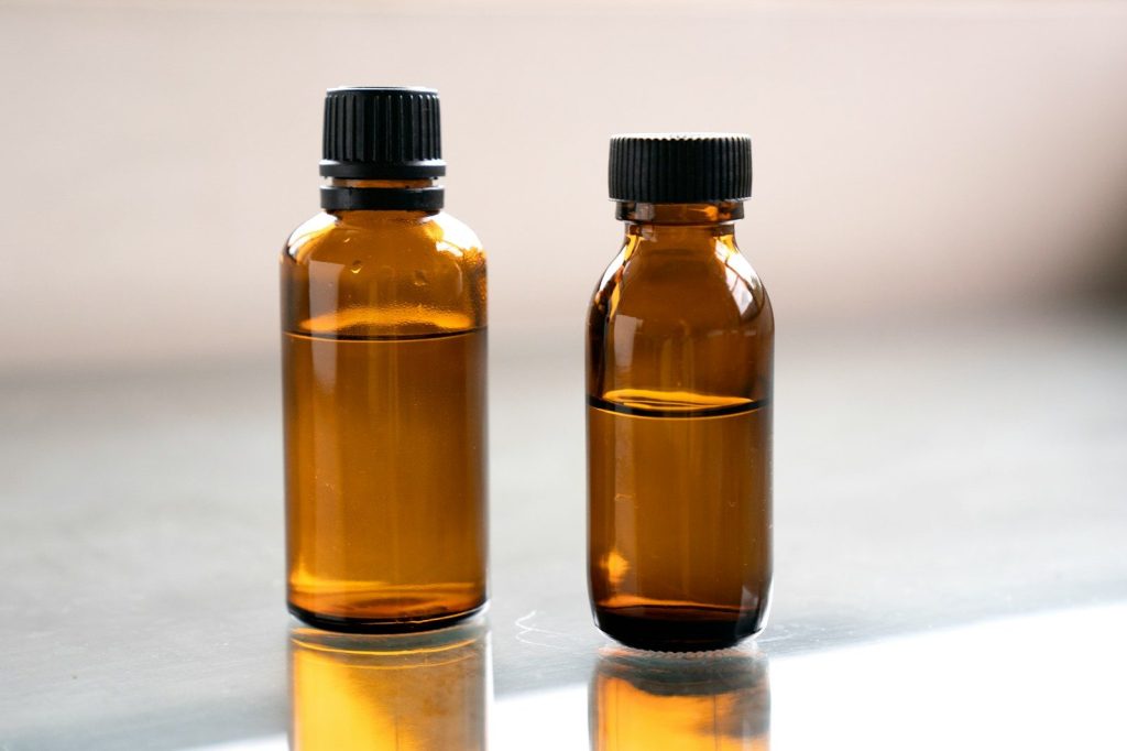 a couple of brown bottles sitting on top of a table