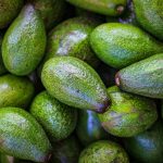 green oval fruits on white surface