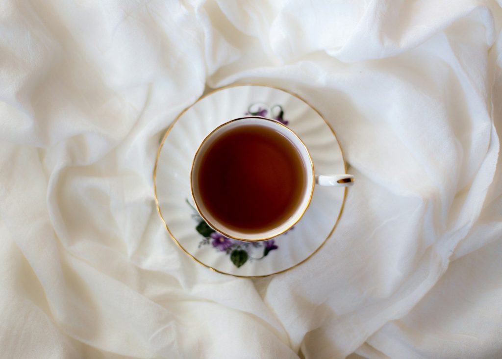 aerial photography of ceramic cup and saucer
