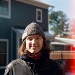 a person standing in front of a house