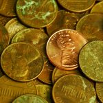 Pile of lincoln pennies with one prominent