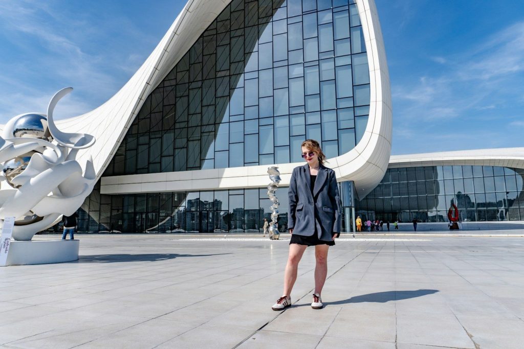 Woman standing in front of modern architecture