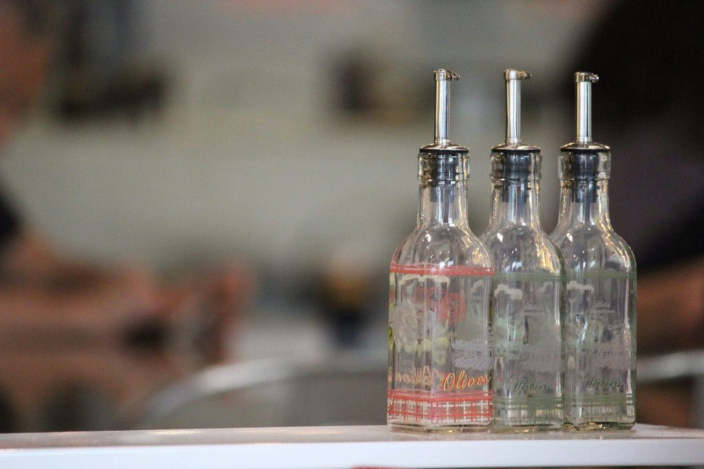 Three glass bottles with pour spouts