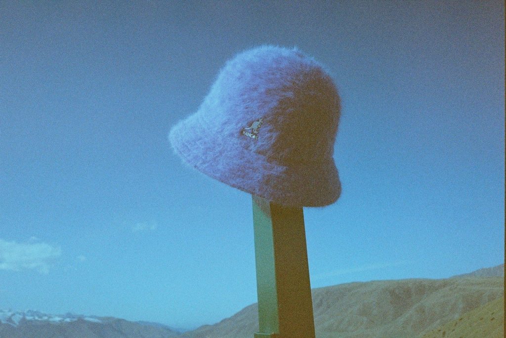 There is a strange hat on top of a pole