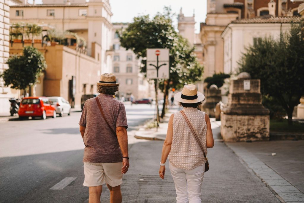 A man and a woman walking down a street