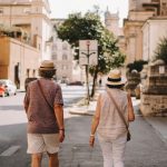 A man and a woman walking down a street