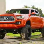 red chevrolet crew cab pickup truck