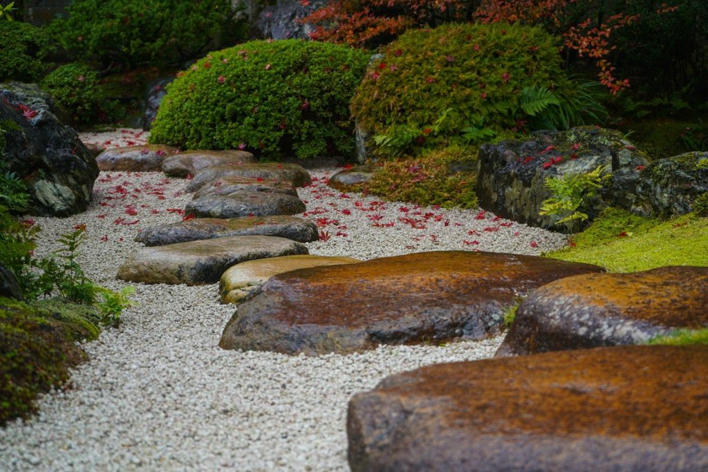 Stepping stones lead through a japanese garden