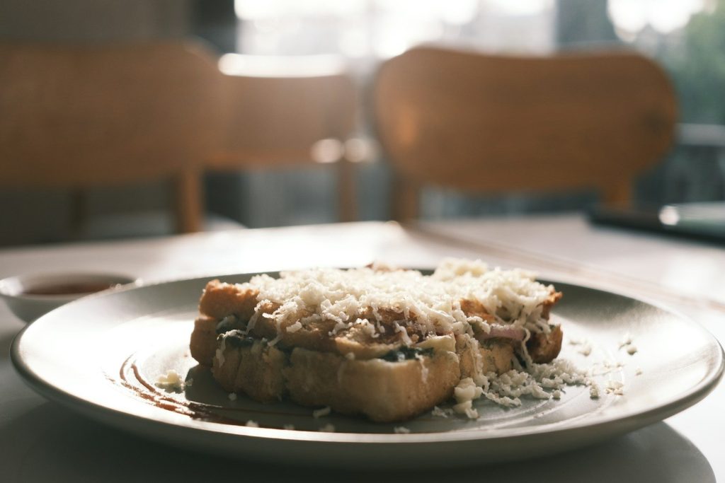 A white plate topped with food on top of a table