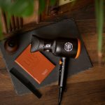 black and orange microphone on brown wooden table