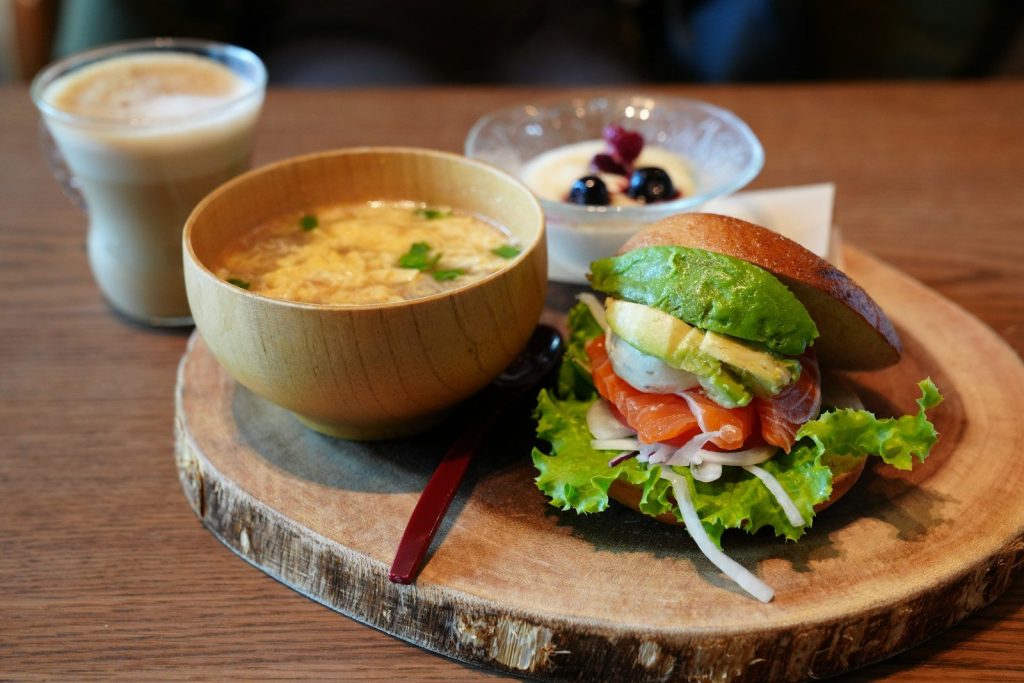 Salmon avocado sandwich with soup and dessert