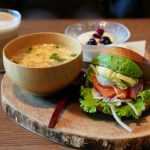 Salmon avocado sandwich with soup and dessert