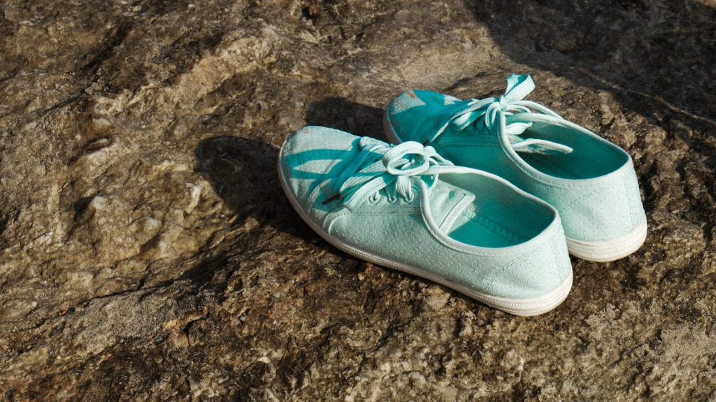 blue and white low top sneakers