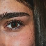 woman with black hair and blue eyes
