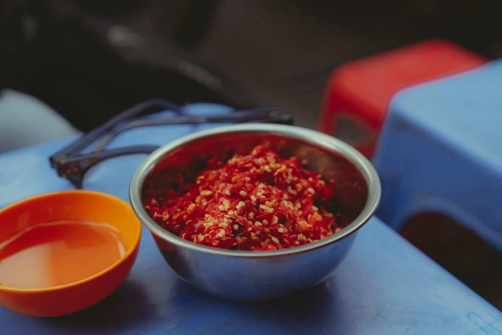 A bowl of food sitting on top of a blue table