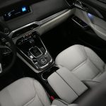 the interior of a car with a steering wheel and dashboard