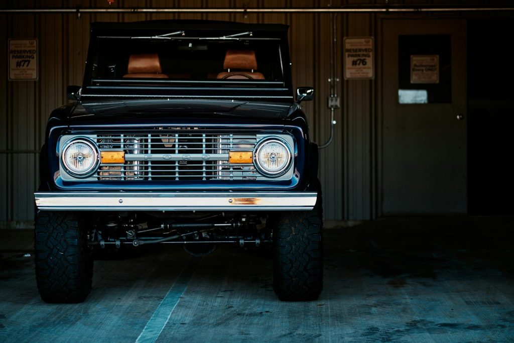 a black truck parked inside of a garage