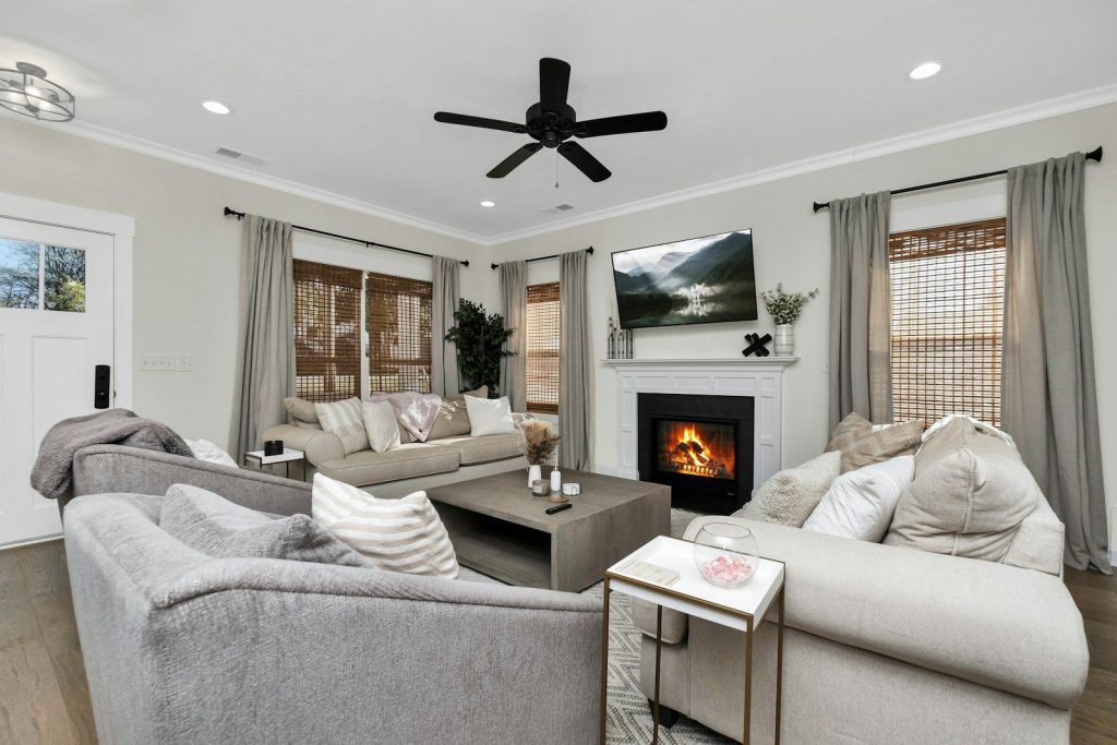a living room filled with furniture and a fire place