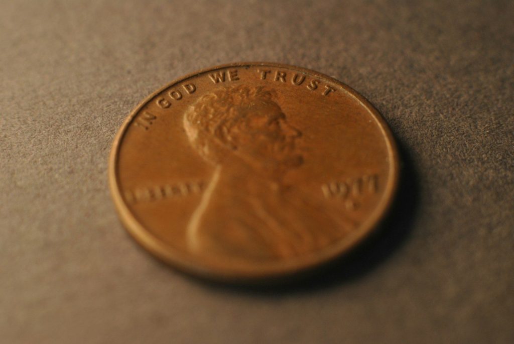 A close up of a penny on a table