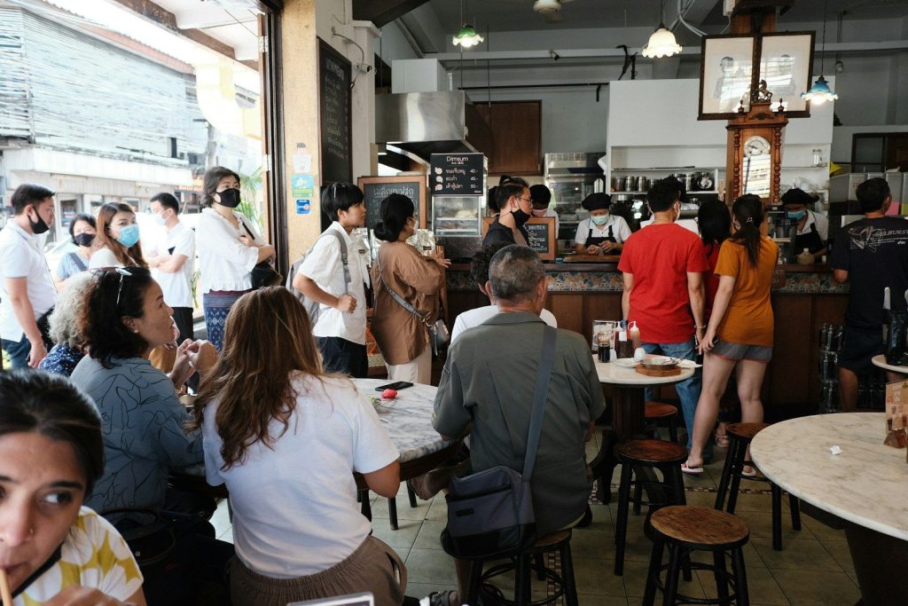 people sitting on chair in restaurant