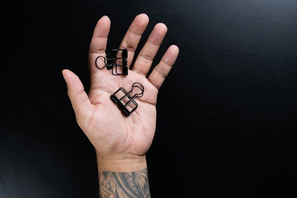 person holding black plastic tool