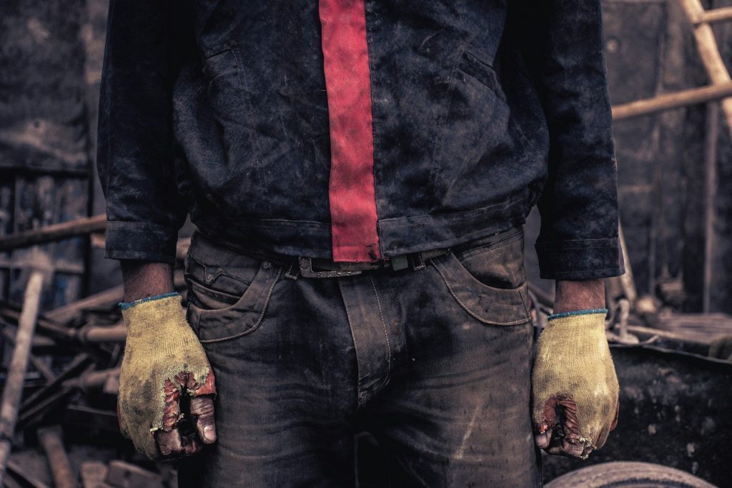 man in black denim jeans