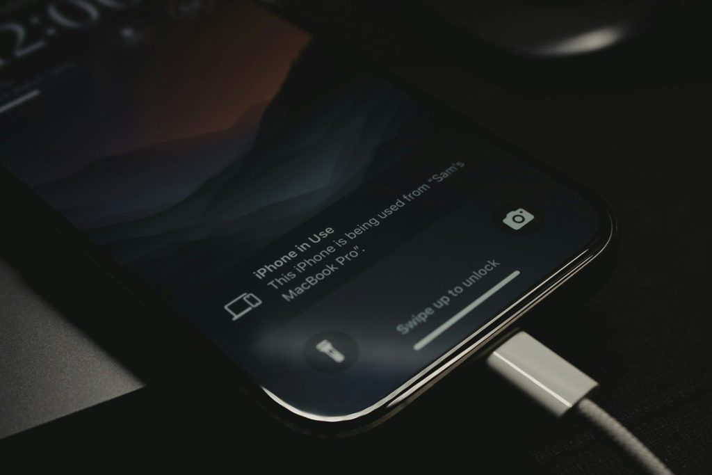 A close up of a cell phone charging