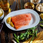 flat lay photography of raw salmon fish