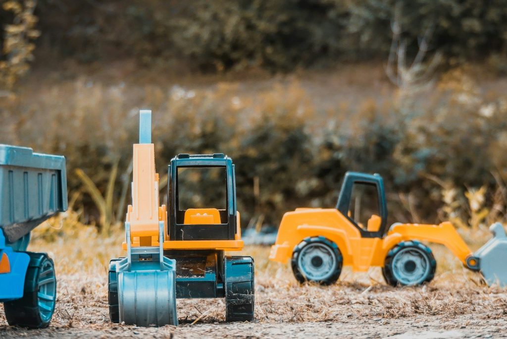 yellow and black heavy equipment toys