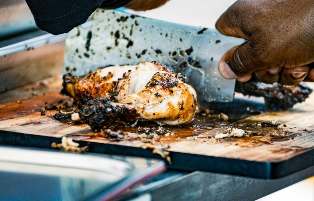 a person is holding a piece of food