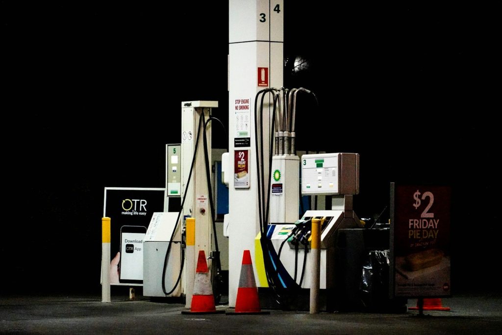 a group of gas pumps sitting next to each other