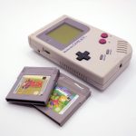 a nintendo game boy with a card and a case