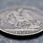 Antique coin with the year 1891 visible