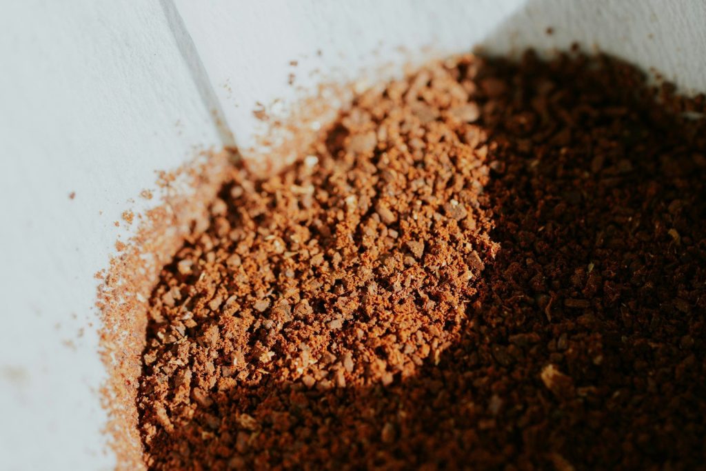 a pile of ground coffee sitting on top of a table