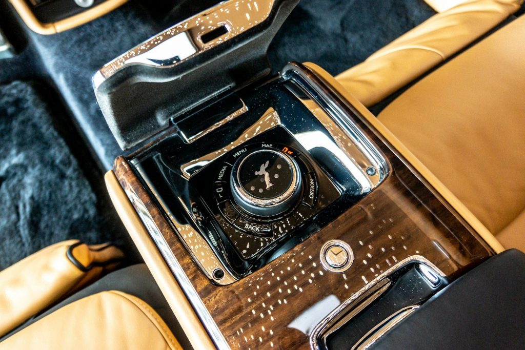 black and silver camera on black textile