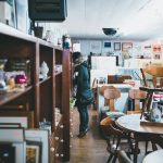 woman standing beside shelf