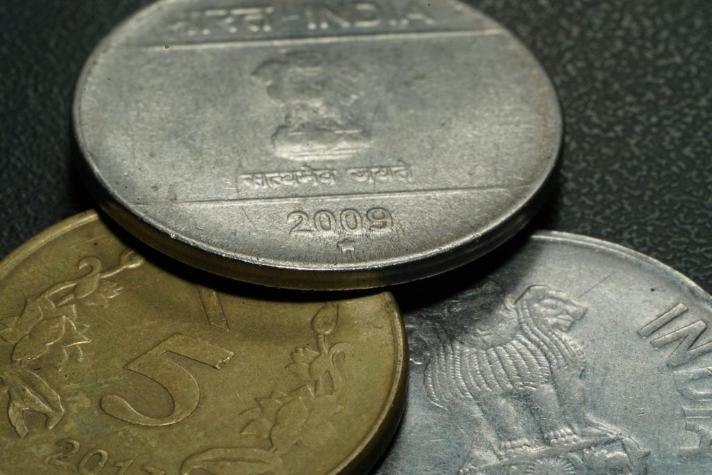 three assorted Indian coins