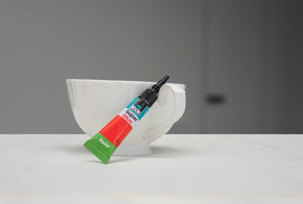 a toothbrush in a cup on a table