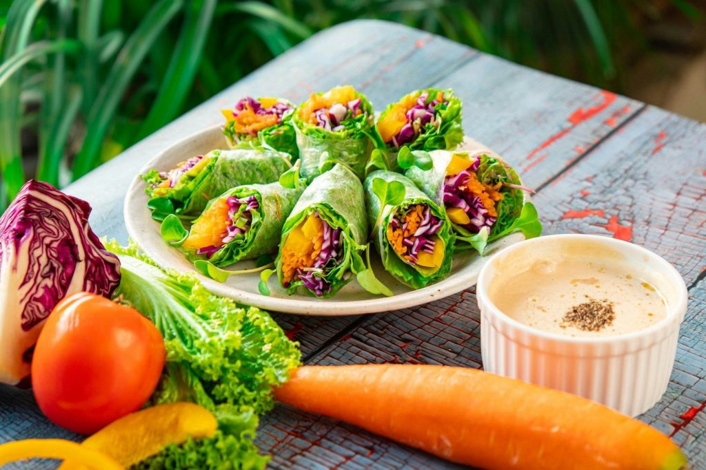 a plate of vegetables and a cup of coffee