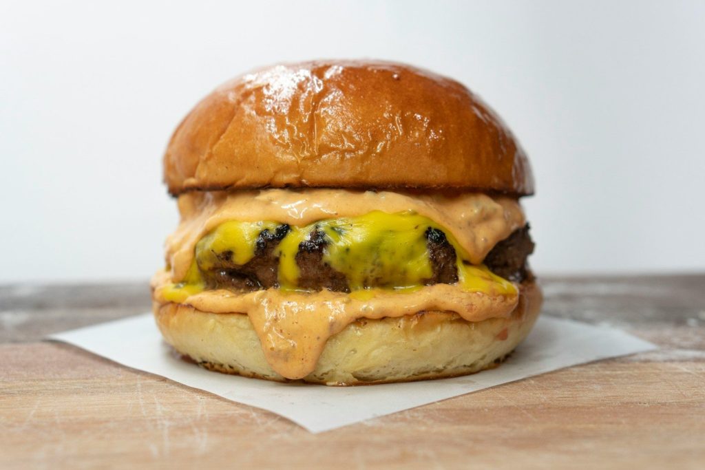 burger on brown wooden table