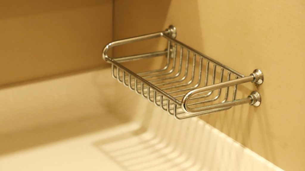 stainless steel rack on white wall