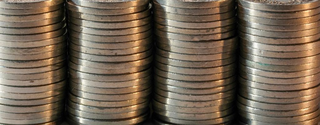 Stacks of silver coins in a row