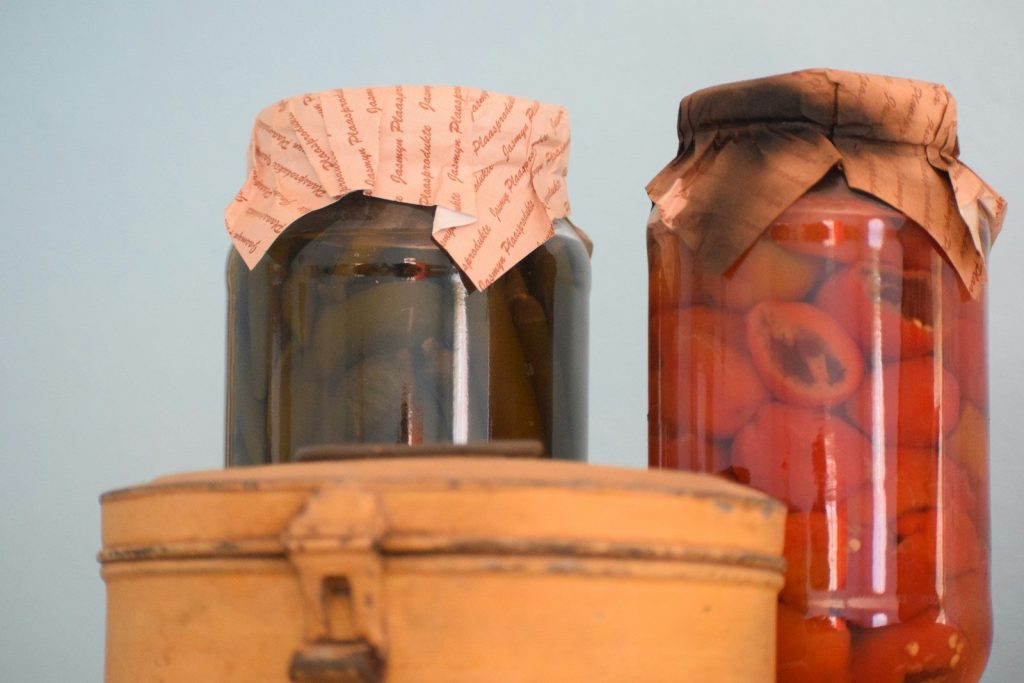 A couple of jars sitting on top of a table