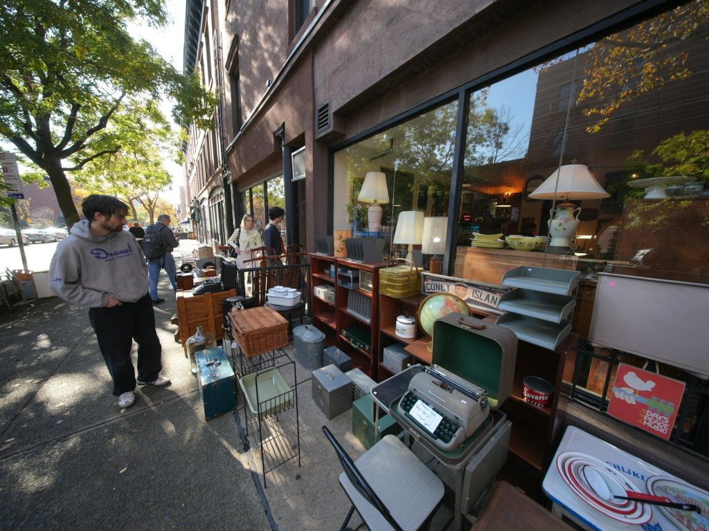 People browse items outside a vintage store