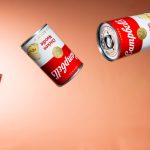 a group of cans of food flying through the air