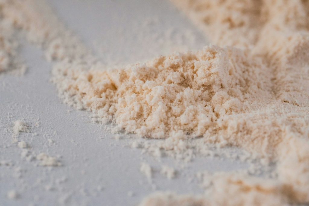 a pile of powdered sugar on a white surface