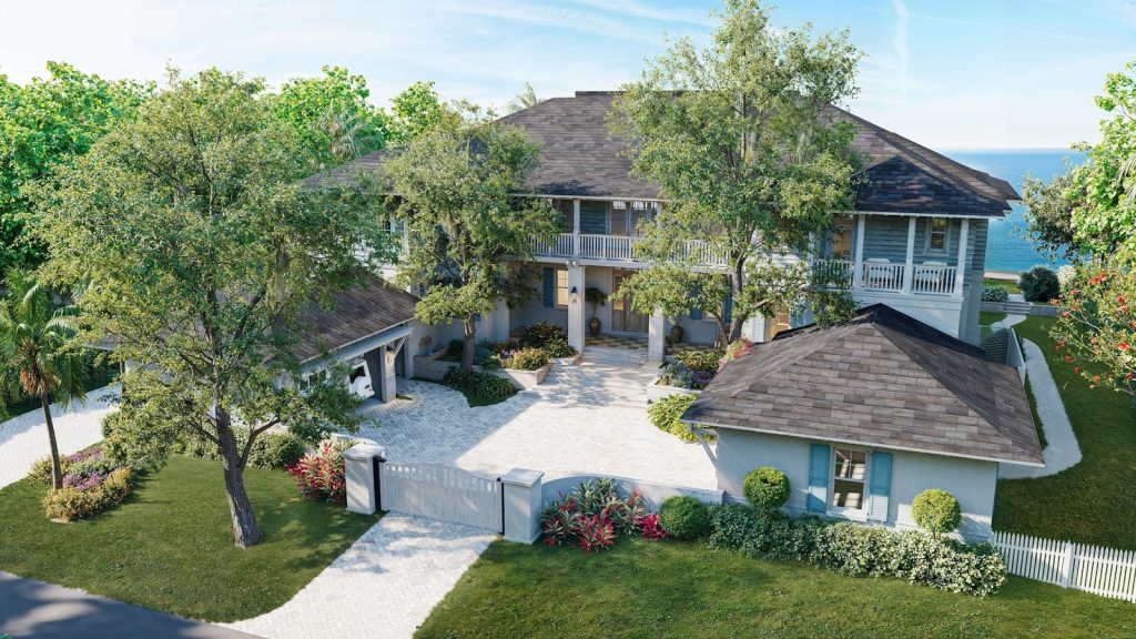 Luxurious waterfront house with manicured lawn and mature trees.