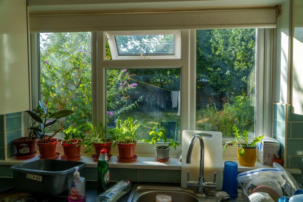 A kitchen with a sink and a window
