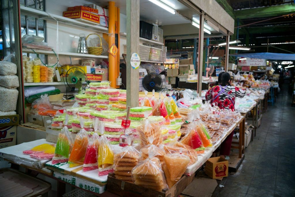 Colorful snacks and drinks displayed at market stalls